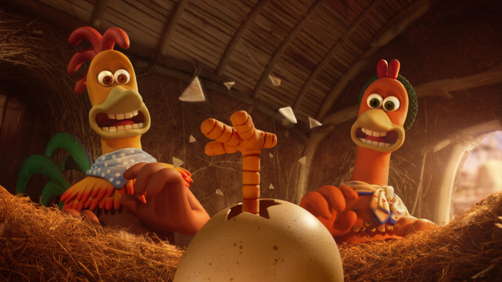 Rocky (Zachary Levi) and Ginger (Thandiwe Newton) looking shocked as a foot protrudes from an egg in Chicken Run: Dawn of the Nugget