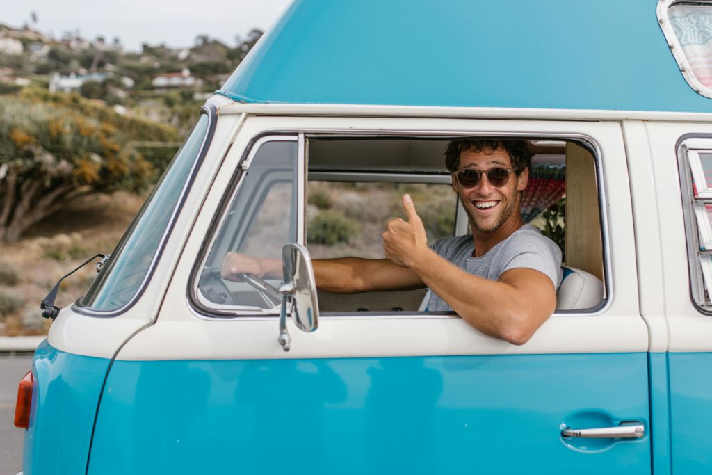 A man driving while wearing sunglasses