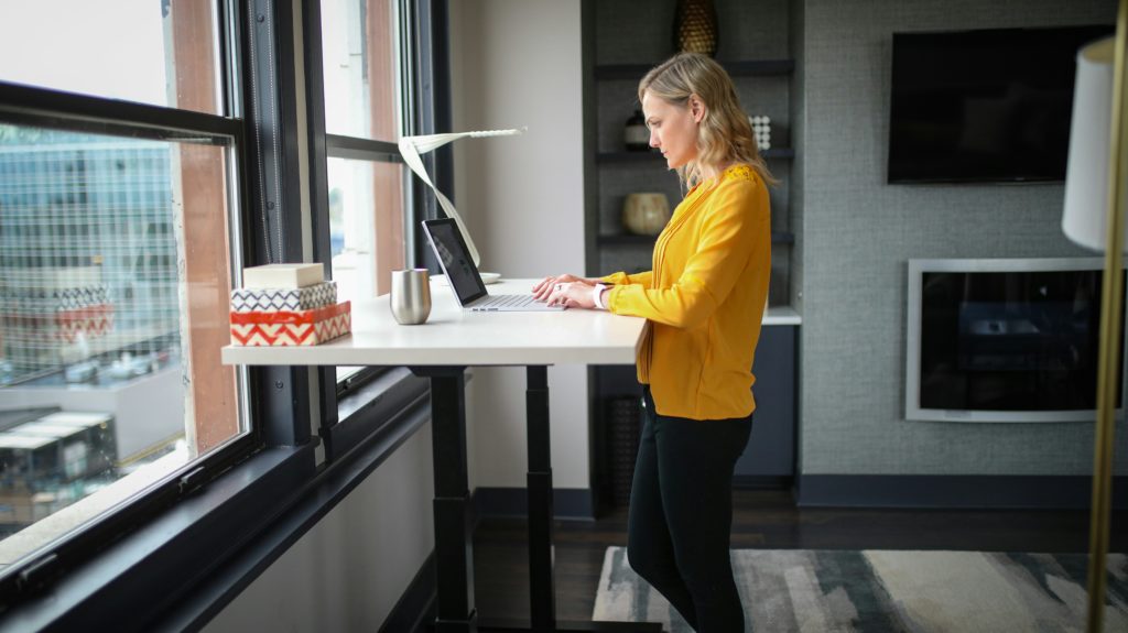 A woman using a standing desk